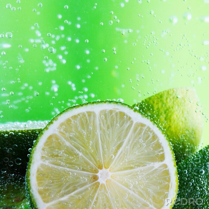 Poster Limonen auf grünem Hintergrund