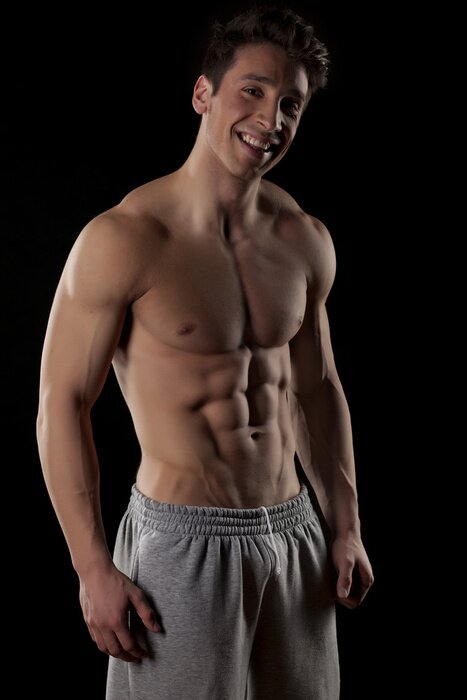 Poster Männlicher Akt auf schwarzem Hintergrund