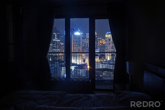 Poster Nachtansicht der Stadt vom Fenster aus