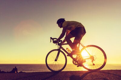 Poster Radfahrer und Sonnenuntergang