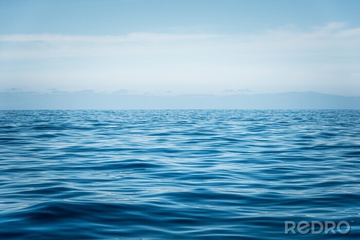 Poster Ruhiges Meerwasser vor dem Himmel