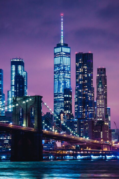 Poster Skyline of downtown New York City Brooklyn Bridge and skyscrapers over East River illuminated with lights at dusk after sunset view from Brooklyn