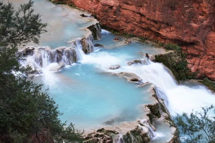 Poster Wasserkaskaden an den Bergen