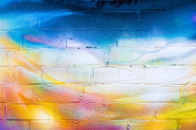 Sticker A fragment of colorful graffiti painted on a brick wall. Abstract backdrop for design.