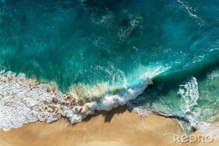 Sticker Abstract white sand beach with turquoise tropical sea water , aerial drone shot. Kelingking Beach in Nusa Penida Bali, Indonesia.