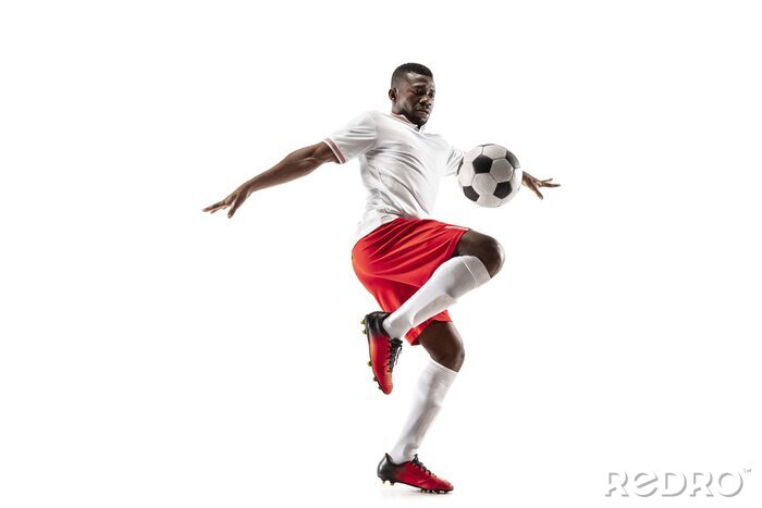 Sticker Afroamerikanischer Fußballspieler schlägt den Ball mit dem Knie