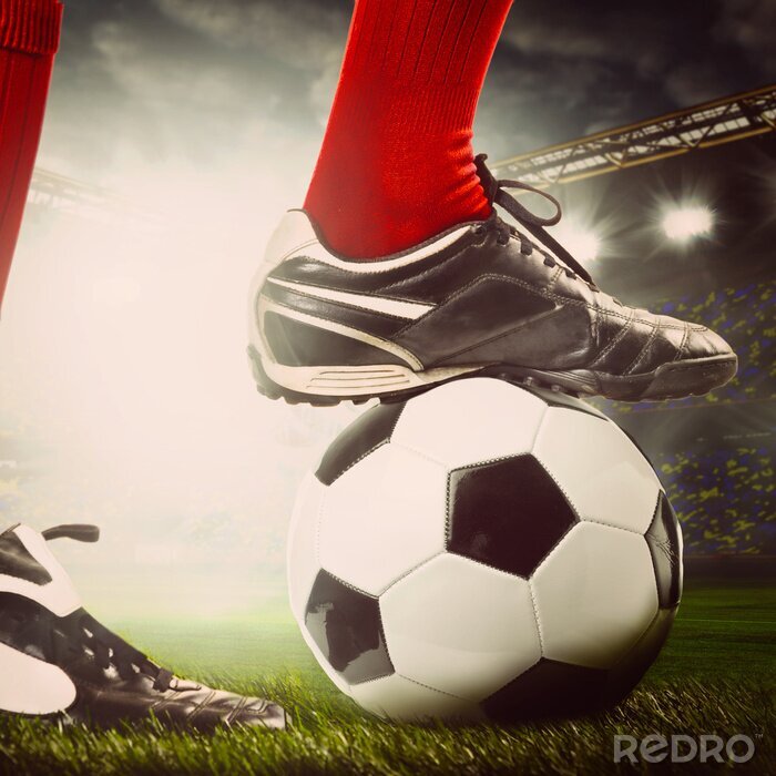 Sticker Beine des Fußballspielers am Ball