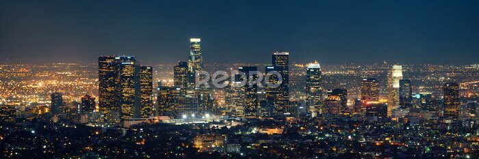 Sticker Beleuchtete Wolkenkratzer in Manhattan bei Nacht