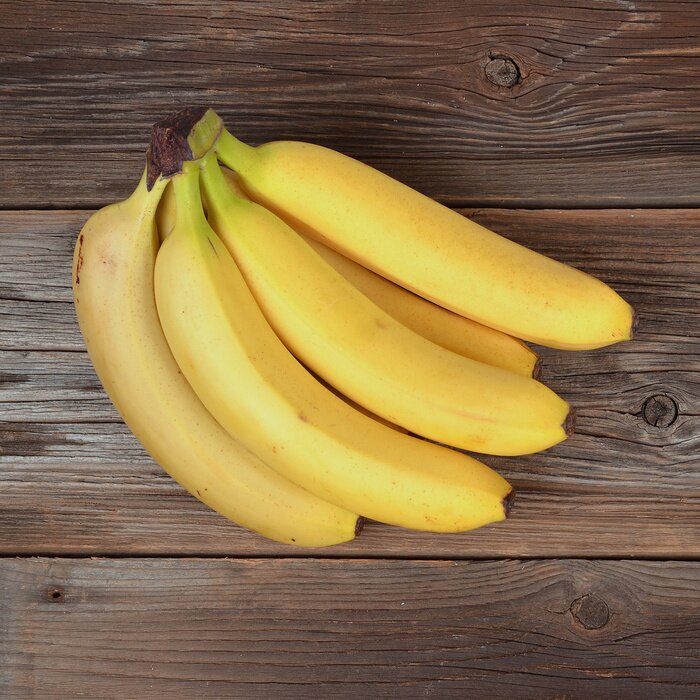 Sticker Bunch von Bananen auf einer Holzoberfläche