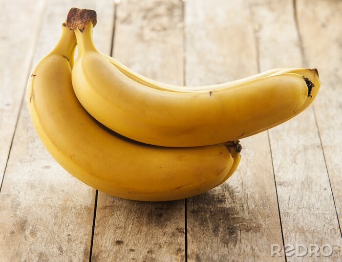 Sticker Bunch von Bananen auf hellbraunen Brettern