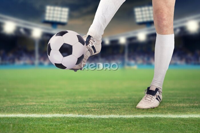 Sticker Ein Fußballspieler prellen den Ball