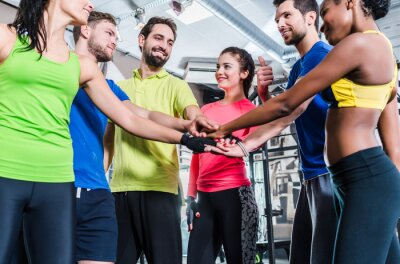 Sticker Frauen und Männer sind motiviert für Sport und Eignung und stapeln die Hände