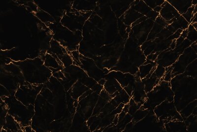 Orange Kratzer auf schwarzem Marmor