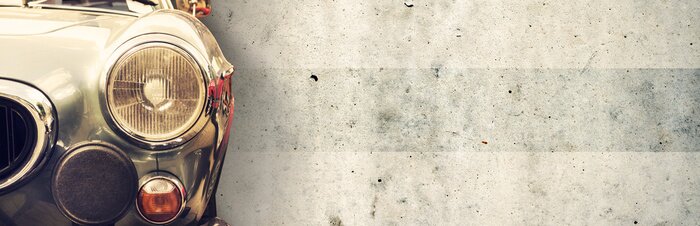 Sticker Teil eines alten Autos vor dem Hintergrund der Wand