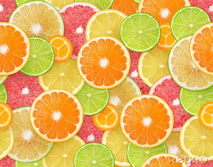 Tapete Scheiben von Zitronen, Orangen, Limetten und Grapefruit